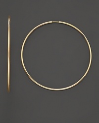 An absolute essential for any woman, this beautiful hoop earring in 14 Kt gold. An absolute essential for any woman, this beautiful hoop earring in 14 Kt gold.