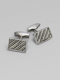 Rectangular sterling silver links are set with hand-twisted wire inlaid within silver bars. Sterling silver About ¼ X ½ Made in the United Kingdom Rectangular sterling silver links are set with hand-twisted wire inlaid within silver bars. Sterling silver About ¼ X ½ Made in the United Kingdom