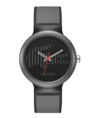 In the shadows. This unisex Goa by Lacoste watch is crafted of gray silicone strap with black piping and round gray plastic case. Black dial features striped iconic crocodile logo, white cut-out hour and minute hand, red second hand and gray text logo at six o'clock. Quartz movement. Water resistant to 30 meters. Two-year limited warranty.