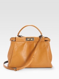 Stash your essentials in this sleek leather carry-all finished with goldtone hardware and a removable shoulder strap for versatility.Top handle, 5½ drop Adjustable removable shoulder strap, 20-26 drop Double turn-lock closure Protective metal feet Split inner compartment One inside zip pocket Cotton lining 14W X 10H X 5D Made in Italy Stash your essentials in this sleek leather carry-all finished with goldtone hardware and a removable shoulder strap for versatility.Top handle, 5½ drop Adjustable removable shoulder strap, 20-26 drop Double turn-lock closure Protective metal feet Split inner compartment One inside zip pocket Cotton lining 14W X 10H X 5D Made in Italy