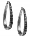Take a turn from the traditional. These chic hoop earrings by Lucky Brand feature an oblong shape crafted in textured silver tone mixed metal. Approximate diameter: 2 inches.
