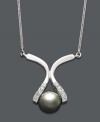 Elegance at its finest. This intricate pendant features a unique 14k white gold setting cradling a cultured Tahitian pearl (8-9 mm). Sides dusted by round-cut diamond accents. Approximate length: 16 inches. Approximate drop: 1 inch.