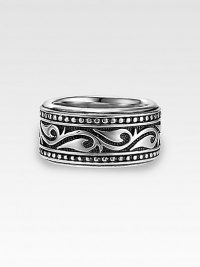 A handsome, sterling silver band is enriched by scrolling Sparta engraving. 13mm wide Made in USA A handsome, sterling silver band is enriched by scrolling Sparta engraving. 13mm wide Made in USA