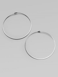 Make a quiet statement in these elegant hoop earrings. Silvertone metalLength, about 2.25Post closureImported Make a quiet statement in these elegant hoop earrings. Silvertone metalLength, about 2.25Post closureImported