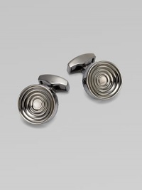 Concentric links of gunmetal-plated metal are polished on the outside and sandblasted in the recessed ridges to enhance the pattern. Gunmetal-plated metal About ½ diam. Made in the United Kingdom Concentric links of gunmetal-plated metal are polished on the outside and sandblasted in the recessed ridges to enhance the pattern. Gunmetal-plated metal About ½ diam. Made in the United Kingdom