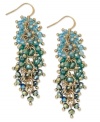 Tasteful in turquoise. Add a vibrant waterfall of color with these cascade cluster earrings from c.A.K.e. by Ali Khan. Crafted in gold tone mixed metal, they feature tonal turquoise color glass beads. Approximate length: 1-3/4 inches.