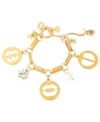 A cut above. Betsey Johnson's multi-charm bracelet is crafted from gold-tone mixed metal with faceted beads and glass crystal accents, adding to the appeal of the charms' cut-out motif. Approximate length: 7-1/2 inches.