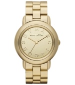 Suit up for glam squad duty with this mirrored Marci watch by Marc by Marc Jacobs. Gold ion-plated stainless steel bracelet and round case. Gold tone mirrored dial features logo letter markers and three hands. Quartz movement. Water resistant to 50 meters. Two-year limited warranty.