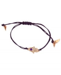 This RACHEL Rachel Roy bracelet showcases a hamsa hand charm with glass stone accents. An adjustable purple waxed cotton cord holds it all together. Set in rose-gold tone mixed metal. Approximate diameter: 1/4 inch. Adjustable from 1 inch to 7-1/4 inches. This RACHEL Rachel Roy bracelet showcases a hamsa hand charm with glass stone accents. An adjustable purple waxed cotton cord holds it all together. Set in rose-gold tone mixed metal. Approximate diameter: 1/4 inch. Adjustable from 1 inch to 7-1/4 inches.