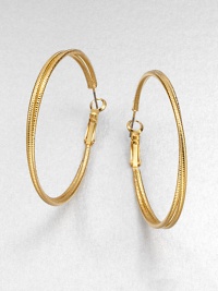 A simply chic piece with two textured rings, intertwined together in a radiant goldtone finish. GoldtoneLength, about 1.8Hinged post backImported 