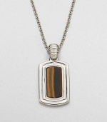Shiny sterling silver frames a center tigers' eye stone, handsomely suspended from a link chain.Sterling silverTigers' eyeLength, about 22Pendant size, about 1 x ½Imported