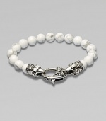 A new look for the modern man, handsomely crafted with a sterling silver raven's head clasp and a string of howlite beads.Sterling silverLobster claspBracelet, 9 longAbout 3 diamImported