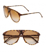 An unique style with a bridge accented with a sleek signature emblem. Available in blonde havana with brown/grey gradient lens. Logo temples100% UV protectionImported