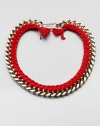 A chunky chain, with the look of a vintage ID bracelet, is modernized with bright red braiding with tassels and a fun paper-clip clasp.GoldplatedCottonLength, about 16.5Spring ring paper clip claspMade in France