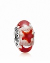 A repeating star pattern adorns a translucent murano glass bead. Logo-engraved sterling silver trim displays the PANDORA signature.