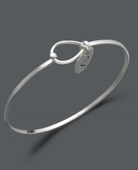 Get caught up in the game of love. This subtly stylish bangle features an engraved heart charm with the word love engraved on the flip side. Crafted in sterling silver. Approximate diameter: 2-3/10 inches. Get caught up in the game of love. This subtly stylish bangle features an engraved heart charm with the word love engraved on the flip side. Crafted in sterling silver. Approximate diameter: 2-3/10 inches.