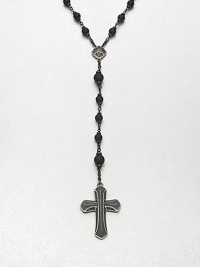 A simple, yet masculine addition to your ensemble, with a strand black onyx beads complemented by a sterling silver cross pendant.Sterling silverBlack onyxAbout 37, inner diam.About 7 dropImported