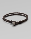 A subtle, yet striking design in woven leather with engraved black rhodium and rose gold bead detail.LeatherSterling silverToggle claspAbout 3½ diam.Imported