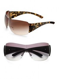 Rimless shield frames adorned with signature logo temple detail. Available in black with gray gradient lens or havana with brown gradient lens. UV 400 lens 100% UV protection Made in Italy Rimless shield frames adorned with signature logo temple detail. Available in black with gray gradient lens or havana with brown gradient lens. UV 400 lens 100% UV protection Made in Italy