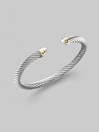 From the Cable Classics Collection. A signature Yurman cable of sterling silver, richly enhanced by white freshwater pearl end caps banded in 14k gold. White freshwater pearls Sterling silver and 14k yellow gold Cable, 5mm Diameter, about 2¼ Imported From the Cable Classics Collection. A signature Yurman cable of sterling silver, richly enhanced by white freshwater pearl end caps banded in 14k gold. White freshwater pearls Sterling silver and 14k yellow gold Cable, 5mm Diameter, about 2¼ Imported