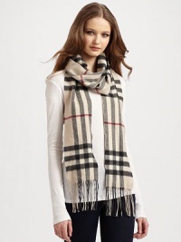 Luxurious and soft cashmere in a classic oversized check pattern. Fringe trim Cashmere About 6 X 79 Dry clean Made in Great Britain Luxurious and soft cashmere in a classic oversized check pattern. Fringe trim Cashmere About 6 X 79 Dry clean Made in Great Britain