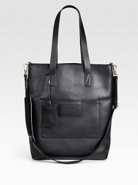 A spacious design crafted in smooth, supple leather with a detachable, adjustable shoulder strap and interior zip pocket.Double top handlesAdjustable shoulder strapIdentification tagInterior zip pocketLeather13 x17 x 3Imported A spacious design crafted in smooth, supple leather with a detachable, adjustable shoulder strap and interior zip pocket.Double top handlesAdjustable shoulder strapIdentification tagInterior zip pocketLeather13 x17 x 3Imported