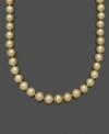 Whisk yourself away to a tropical paradise. Belle de Mer's cultured golden south sea pearls (10-12 mm) set in matching 14k gold add an exotic touch to any ensemble. Approximate length: 18 inches.