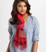 A semi-sheer, woven wrap in a colorblocked design with fringe trim.90% merino wool/10% acrylic80 X 26Hand washImported