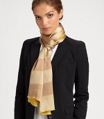 Bold stripes adorn a sumptuous silk wrap with logo detail and eyelash fringe.Silk23 X 71Dry cleanImported