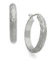 A dazzling display. Giani Bernini's hoop earrings, set in sterling silver, sparkle with a stylish pattern along the outside that only enhances the appeal. Approximate diameter: 7/8 inch.