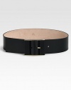 Tone on tone leather-covered buckle with light gold hardware and an engraved logo detail.About 2.4 wideMade in Italy 