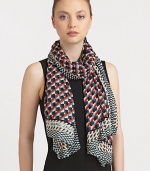 A woven modal scarf is embellished with a colorful print with contrasting border.ModalAbout 65 X 46Dry cleanImported