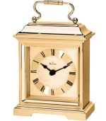 This formal carriage clock by Bulova adds elegance to an end table or side board. Rectangular spun and brushed gold tone aluminum case features a curved handle at top. Gold tone dial displays black Roman numerals and two hands.