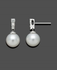 Simple enough to be worn every day, but glamorous enough to always create a statement. Belle de Mer's timeless drop earrings highlight a cultured freshwater pearl (9-10mm) with sparkling, round-cut diamonds (1/4 ct. t.w.) decorating a 14k white gold post setting. Approximate drop: 9/10 inch. Simple enough to be worn every day, but glamorous enough to always create a statement. Belle de Mer's timeless drop earrings highlight a cultured freshwater pearl (9-10mm) with sparkling, round-cut diamonds (1/4 ct. t.w.) decorating a 14k white gold post setting. Approximate drop: 9/10 inch.