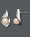 Subtly sophisticated. These petite stud earrings make a poignant statement with pink cultured freshwater pearls (7-8 mm), a sterling silver setting, and sparkling diamond accents. Approximate diameter: 7/8 inch.