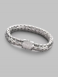 A rich woven chain of sterling silver with a barrel clasp of 18k white gold and pavé diamonds. Diamonds, 0.62 tcw Sterling silver and 18k white gold Length, about 7½ Width, about ¼ Push-lock clasp Made in Bali A rich woven chain of sterling silver with a barrel clasp of 18k white gold and pavé diamonds. Diamonds, 0.62 tcw Sterling silver and 18k white gold Length, about 7½ Width, about ¼ Push-lock clasp Made in Bali
