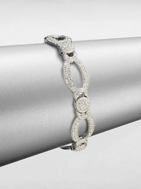 A graceful design featuring links in various shapes accented in pavé crystals. CrystalsRhodium-plated brassLength, about 7.5Box and tongue closureImported A graceful design featuring links in various shapes accented in pavé crystals. CrystalsRhodium-plated brassLength, about 7.5Box and tongue closureImported