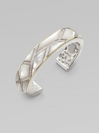 A narrow design with opulent mother-of-pearl and sparkling white sapphires set in sterling silver accented with radiant 18k gold. Mother-of-pearlWhite sapphireSterling silver18K goldHinged closureDiameter, about 2¾Imported 