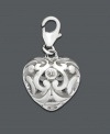Add a drop of silver sophistication to any necklace or bracelet. This intricate scrolling heart charm features cubic zirconia accents. Set in sterling silver. Approximate drop: 1/2 inch.