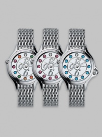 Dazzling topaz stones accent this classic, stainless steel design featuring a unique rolling gemstone mechanism that changes the semiprecious markers for three different looks, with a single stationary diamond at 12.Swiss quartz movement Water resistant to 3 ATM Round stainless steel case, 38mm, (1.49) White dial Topaz and single diamond markers, 2.9 tcw Arabic numeral hour markers Bracelet strap Made in Switzerland Dazzling topaz stones accent this classic, stainless steel design featuring a unique rolling gemstone mechanism that changes the semiprecious markers for three different looks, with a single stationary diamond at 12.Swiss quartz movement Water resistant to 3 ATM Round stainless steel case, 38mm, (1.49) White dial Topaz and single diamond markers, 2.9 tcw Arabic numeral hour markers Bracelet strap Made in Switzerland