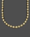 Like individual nuggets of gold, these pearls feature a unique, asymmetrical texture and design. Belle de Mer's rich necklace features golden cultured south sea pearls (9-11 mm) set in 14k gold. Approximate length: 18 inches.