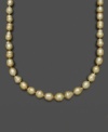 Like individual nuggets of gold, these pearls feature a unique, asymmetrical texture and design. Belle de Mer's rich necklace features golden cultured south sea pearls (9-11 mm) set in 14k gold. Approximate length: 18 inches.