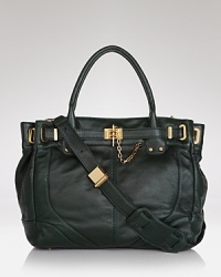 The tote is a season-to-season staple, and Rachel Zoe's leather version is decidedly major. Channel your inner Zoe-bot --this bag is dramatic with face-shielding frames and boho layers. The tote is a season-to-season staple, and Rachel Zoe's leather version is decidedly major. Channel your inner Zoe-bot --this bag is dramatic with face-shielding frames and boho layers.
