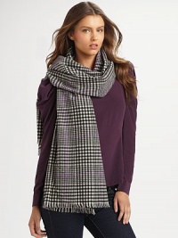 A woven plaid style with baby fringe trim. Wool About 74¾ X 25½ Dry clean Imported A woven plaid style with baby fringe trim. Wool About 74¾ X 25½ Dry clean Imported