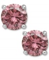 Perfection in pink. These sparkling stud earrings feature round-cut pink diamonds (1-1/2 ct. t.w.) in a four-prong setting of 14k white gold. Approximate diameter: 1/4 inch.