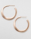 An elegant design in 18k gold and sterling silver with a warm 18k rose goldplating. 18k gold and sterling silver with 18k rose goldplatingLength, about 1.6Post backImported 