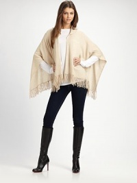 A casual style with an open drape front, warm hood and pretty fringe details in luxurious cashmere. HoodedOpen, draped frontPull-over styleFringed hemAbout 28 from back shoulder to hemCashmereDry cleanImported A casual style with an open drape front, warm hood and pretty fringe details in luxurious cashmere. HoodedOpen, draped frontPull-over styleFringed hemAbout 28 from back shoulder to hemCashmereDry cleanImported