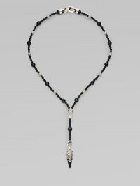 A handsomely crafted sterling silver pendant hangs from a strand of onyx beads. Sterling silver Onxy Pendant, about 1½ long Necklace, about 22 long Imported A handsomely crafted sterling silver pendant hangs from a strand of onyx beads. Sterling silver Onxy Pendant, about 1½ long Necklace, about 22 long Imported