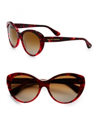 Simple and timeless, this style showcases a classic cat's-eye shape with polarized lenses and a discreet logo running along the temple. Available in textured garnet with solar polarized brown gradient lens or black tortoise with solar polarized brown gradient lens. Logo accented templesSolar polarized lens100% UV protectionImported