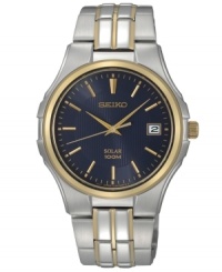 High-powered craftsmanship in a stylish presentation, by Seiko. Crafted of two-tone stainless steel bracelet and round case with gold-tone bezel. Dark blue dial with gold-tone hands, applied stick indices at markers, date window at three o'clock and logo at twelve o'clock. Solar-powered quartz movement. Water resistant to 100 meters. Three-year limited warranty.